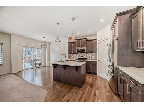 67 Sundown Terrace, Cochrane, AB - Indoor Photo Showing Kitchen With Upgraded Kitchen