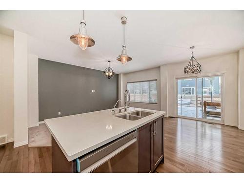 67 Sundown Terrace, Cochrane, AB - Indoor Photo Showing Kitchen With Double Sink