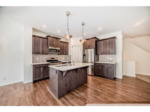 67 Sundown Terrace, Cochrane, AB - Indoor Photo Showing Kitchen With Upgraded Kitchen