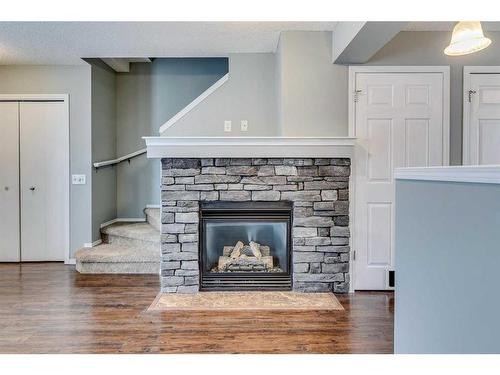 140 Elgin Point Se, Calgary, AB - Indoor Photo Showing Living Room With Fireplace