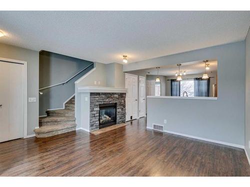 140 Elgin Point Se, Calgary, AB - Indoor Photo Showing Living Room With Fireplace