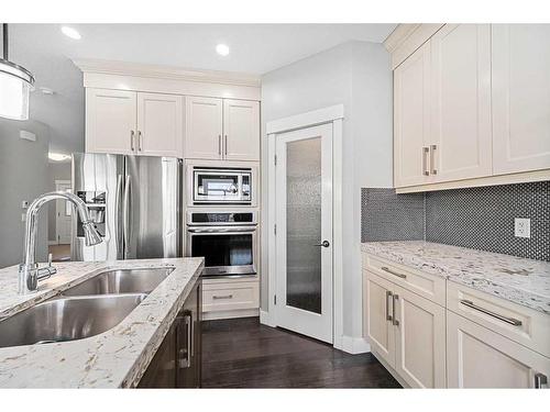 1108 Veterans Avenue, Crossfield, AB - Indoor Photo Showing Kitchen With Stainless Steel Kitchen With Double Sink With Upgraded Kitchen