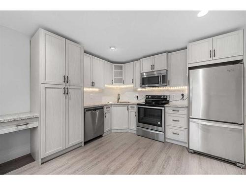 1108 Veterans Avenue, Crossfield, AB - Indoor Photo Showing Kitchen With Stainless Steel Kitchen