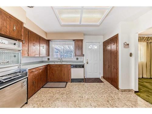 35 Hendon Drive Nw, Calgary, AB - Indoor Photo Showing Kitchen With Double Sink