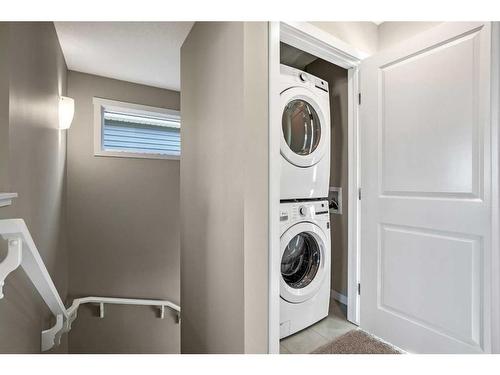 18 Wedderburn Gate, Okotoks, AB - Indoor Photo Showing Laundry Room