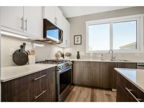 18 Wedderburn Gate, Okotoks, AB - Indoor Photo Showing Kitchen With Double Sink With Upgraded Kitchen