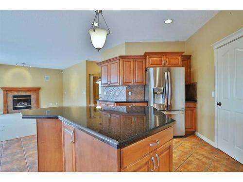 4654 Hamptons Way Nw, Calgary, AB - Indoor Photo Showing Kitchen With Fireplace