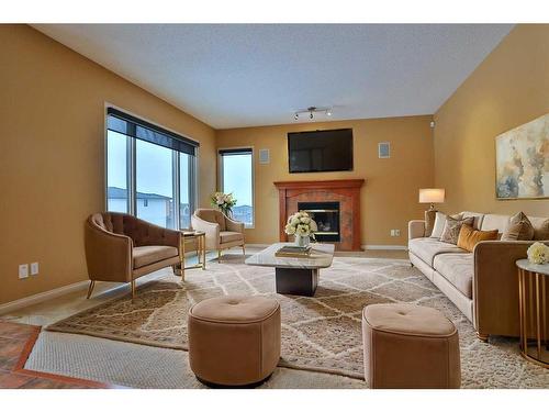 4654 Hamptons Way Nw, Calgary, AB - Indoor Photo Showing Living Room With Fireplace