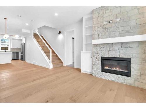 1742 24A Street Sw, Calgary, AB - Indoor Photo Showing Living Room With Fireplace