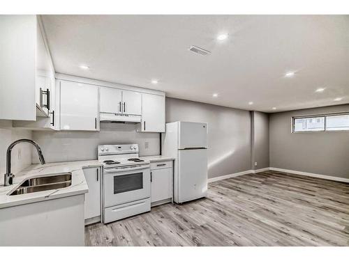 1180 Berkley Drive Nw, Calgary, AB - Indoor Photo Showing Kitchen With Double Sink