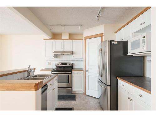 84 West Springs Gate Sw, Calgary, AB - Indoor Photo Showing Kitchen With Double Sink