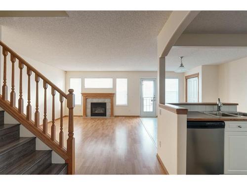 84 West Springs Gate Sw, Calgary, AB - Indoor With Fireplace