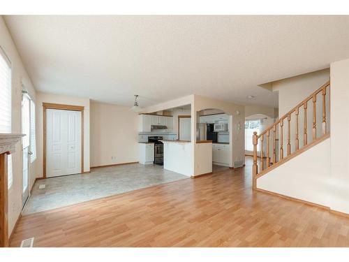 84 West Springs Gate Sw, Calgary, AB - Indoor With Fireplace