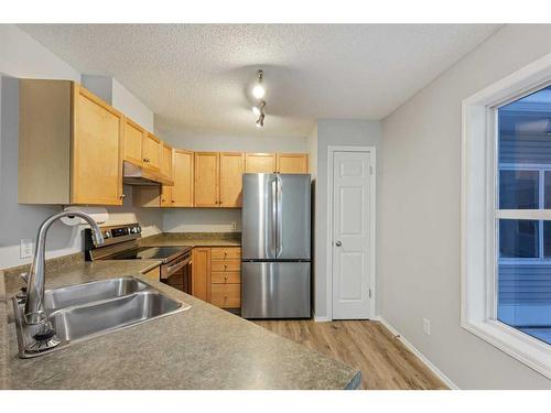 348 Mckenzie Towne Link Se, Calgary, AB - Indoor Photo Showing Kitchen With Stainless Steel Kitchen With Double Sink