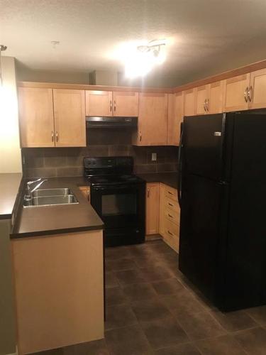 4206-31 Country Village Manor Ne, Calgary, AB - Indoor Photo Showing Kitchen With Double Sink