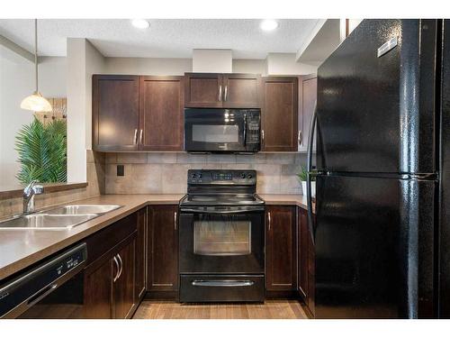 140 Country Village Manor Ne, Calgary, AB - Indoor Photo Showing Kitchen With Double Sink