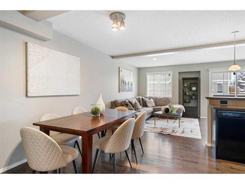 140 Country Village Manor Ne, Calgary, AB - Indoor Photo Showing Dining Room With Fireplace