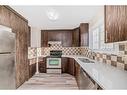 3 Templeby Way Ne, Calgary, AB  - Indoor Photo Showing Kitchen With Stainless Steel Kitchen With Double Sink 