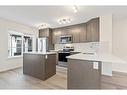 709-474 Seton Circle Se, Calgary, AB  - Indoor Photo Showing Kitchen With Upgraded Kitchen 