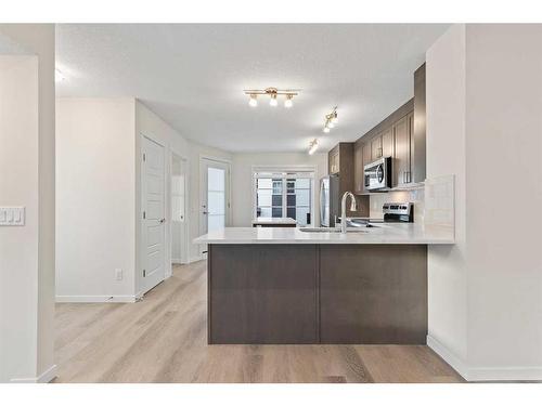 709-474 Seton Circle Se, Calgary, AB - Indoor Photo Showing Kitchen