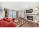 47 Auburn Bay Boulevard Se, Calgary, AB  - Indoor Photo Showing Living Room With Fireplace 