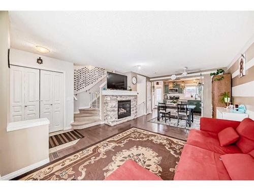 47 Auburn Bay Boulevard Se, Calgary, AB - Indoor Photo Showing Living Room With Fireplace