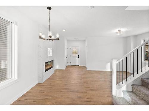 139 Lewiston Drive Ne, Calgary, AB - Indoor Photo Showing Other Room With Fireplace