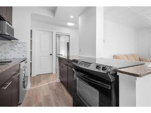 403-501 57 Avenue Sw, Calgary, AB - Indoor Photo Showing Kitchen With Upgraded Kitchen