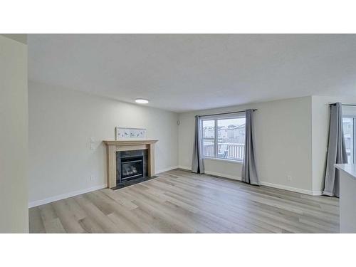 246 Saddlefield Place Ne, Calgary, AB - Indoor Photo Showing Living Room With Fireplace