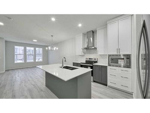 605 Dawson Drive, Chestermere, AB - Indoor Photo Showing Kitchen With Stainless Steel Kitchen With Double Sink With Upgraded Kitchen