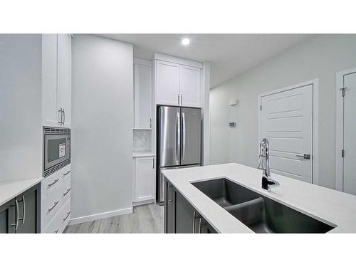 605 Dawson Drive, Chestermere, AB - Indoor Photo Showing Kitchen With Double Sink