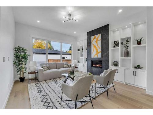 510 14 Avenue Ne, Calgary, AB - Indoor Photo Showing Living Room With Fireplace