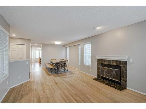 425 15 Street Nw, Calgary, AB - Indoor Photo Showing Living Room With Fireplace