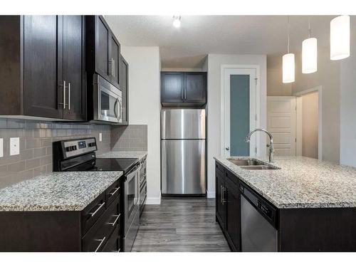 1416-2461 Baysprings Link Sw, Airdrie, AB - Indoor Photo Showing Kitchen With Double Sink With Upgraded Kitchen