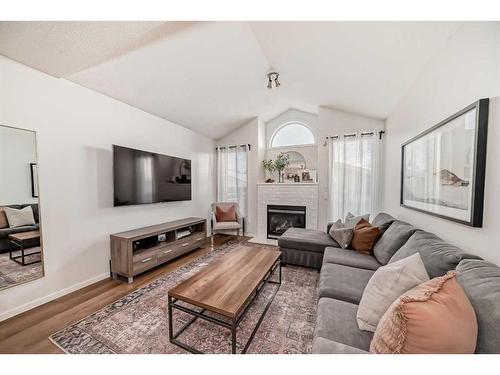 37 Tuscany Springs Park Nw, Calgary, AB - Indoor Photo Showing Living Room With Fireplace