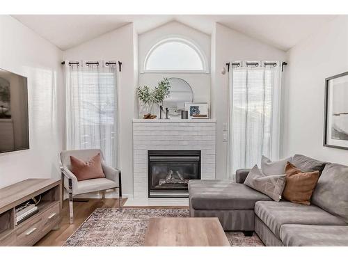 37 Tuscany Springs Park Nw, Calgary, AB - Indoor Photo Showing Living Room With Fireplace