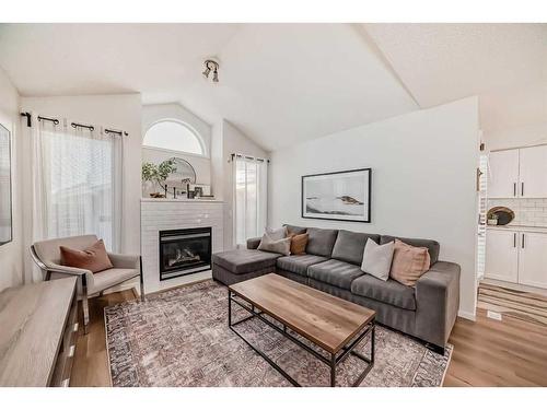 37 Tuscany Springs Park Nw, Calgary, AB - Indoor Photo Showing Living Room With Fireplace