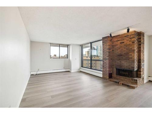 703-1020 14 Avenue Sw, Calgary, AB - Indoor Photo Showing Other Room With Fireplace