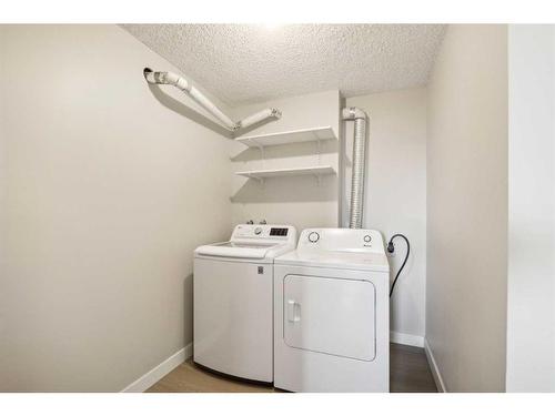 703-1020 14 Avenue Sw, Calgary, AB - Indoor Photo Showing Laundry Room