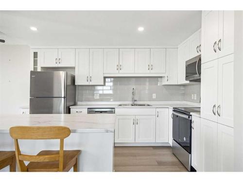 703-1020 14 Avenue Sw, Calgary, AB - Indoor Photo Showing Kitchen With Stainless Steel Kitchen With Double Sink With Upgraded Kitchen