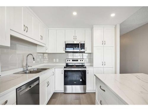 703-1020 14 Avenue Sw, Calgary, AB - Indoor Photo Showing Kitchen With Stainless Steel Kitchen With Double Sink