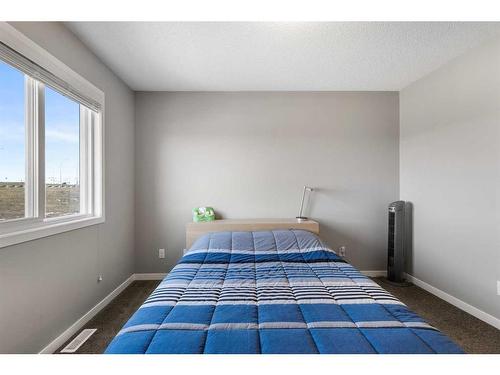 510 Panatella Walk Nw, Calgary, AB - Indoor Photo Showing Bedroom