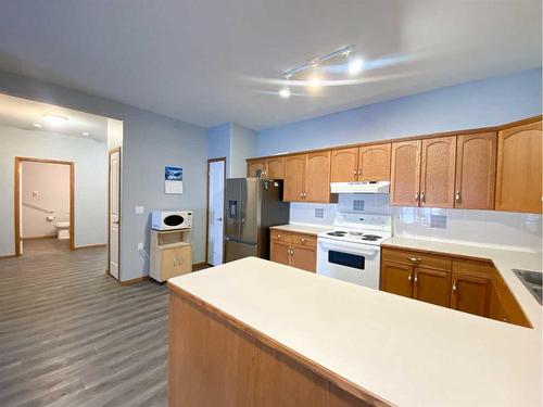 104-5600 Sunrise Crescent, Olds, AB - Indoor Photo Showing Kitchen With Double Sink