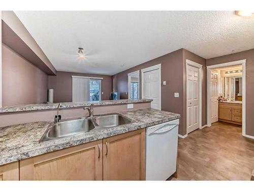 9119-70 Panamount Drive Nw, Calgary, AB - Indoor Photo Showing Kitchen With Double Sink