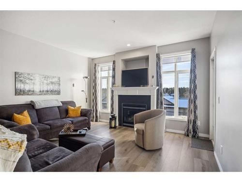 1314-1314 Lake Fraser Green Se, Calgary, AB - Indoor Photo Showing Living Room With Fireplace