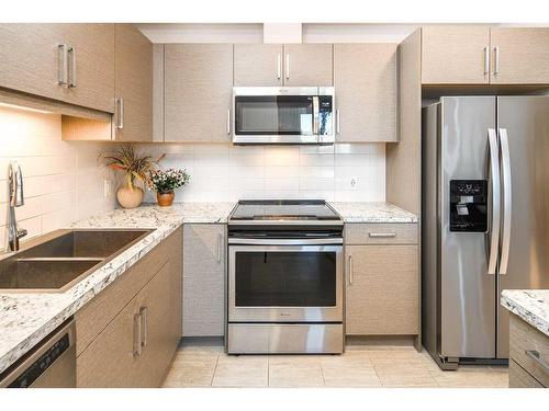 1208-80 Greenbriar Place Nw, Calgary, AB - Indoor Photo Showing Kitchen With Stainless Steel Kitchen With Double Sink With Upgraded Kitchen