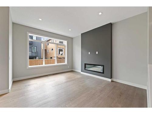 137 Waterford Heath, Chestermere, AB - Indoor Photo Showing Living Room With Fireplace