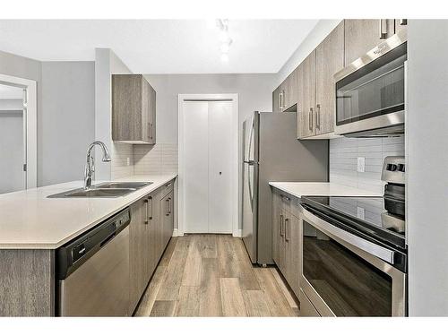 2312-4641 128 Avenue Ne, Calgary, AB - Indoor Photo Showing Kitchen With Stainless Steel Kitchen With Double Sink