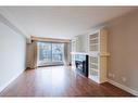 110-355 5 Avenue Ne, Calgary, AB  - Indoor Photo Showing Living Room With Fireplace 