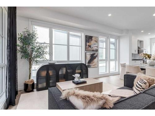 410-1453 Na'A Drive Sw, Calgary, AB - Indoor Photo Showing Living Room With Fireplace